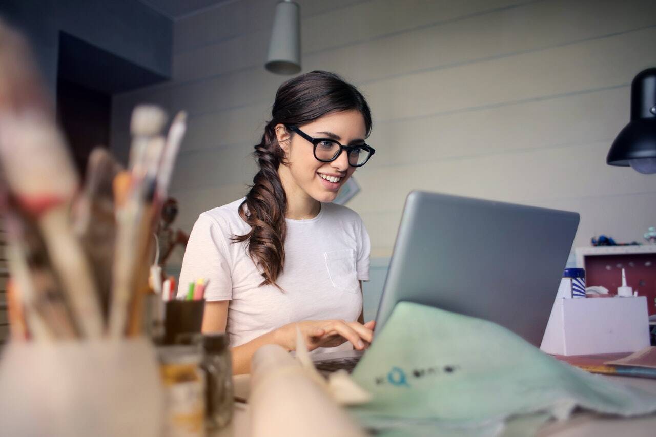 A woman typing on a computer